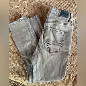 American Eagle Outfitters light wash v-rise distressed jeggings